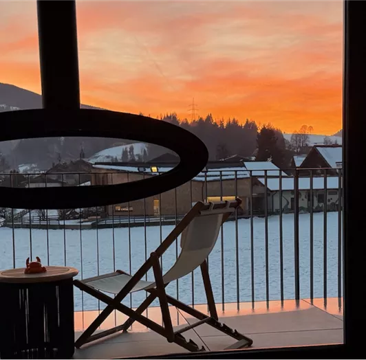 AlpenSkySuiteFlachau_Aussicht_Wohnbereich_Sunset