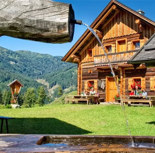 A traditional alpine hut in the mountains.