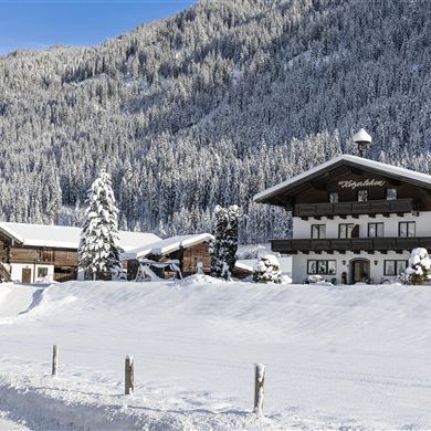 The farm in the depths of winter wrapped in an icy blanket of snow